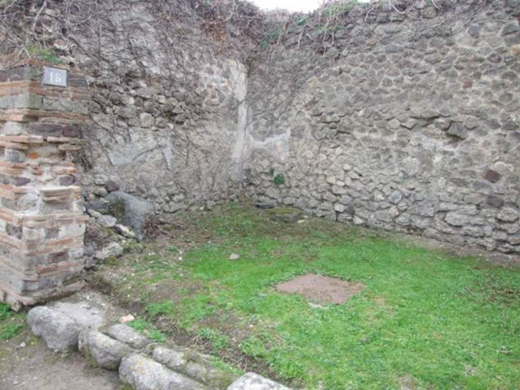 VII.3.18 Pompeii. Shop. December 2007. South wall with latrine near door, remains of staircase and cistern mouth at rear.