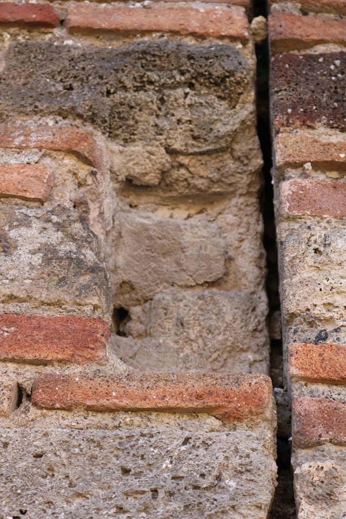 VII.3.23 Pompeii. December 2018.
Detail from pilaster on north side of entrance doorway. Photo courtesy of Aude Durand.