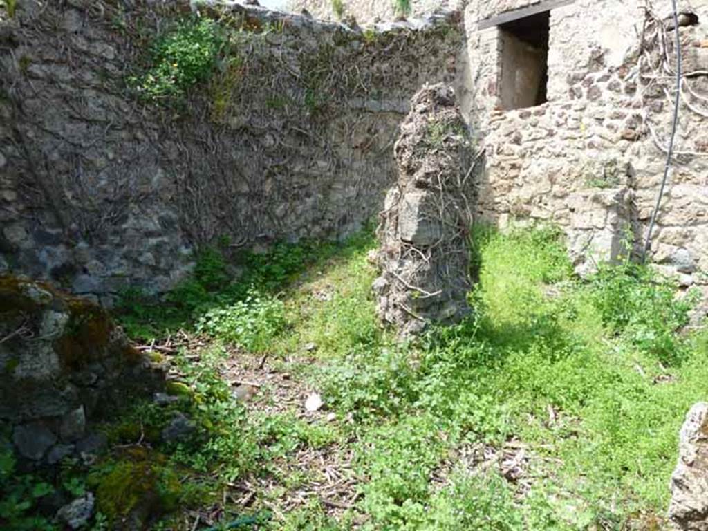 VII.3.23 Pompeii. May 2010. Rear of house in the north-west corner. On the left was the site of the kitchen, on the right was a small open yard, or light-well.
