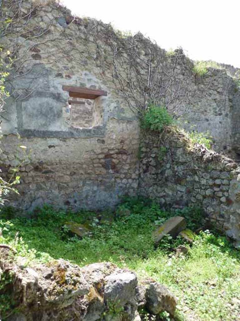 VII.3.23 Pompeii. May 2010. South-west corner of the triclinium, with the window in the south wall overlooking the Vicolo del Panettiere.