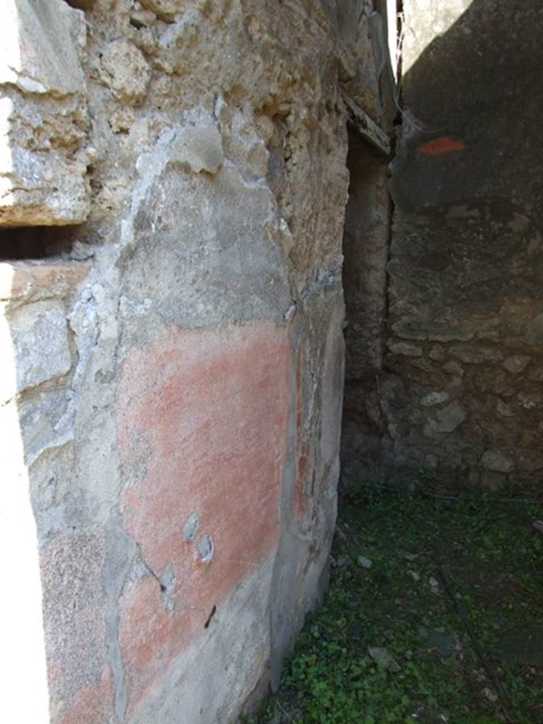 VII.3.29 Pompeii. March 2009. Room 12, north wall of corridor with doorway to garden area (no access). In this area were also an exedra or triclinium, another triclinium with window onto the garden and a niche shrine. According to Richardson, the best rooms of the house were a pair of dining rooms opening onto a small garden. These opened off a small square area that contained the lararium niche. The triclinium opened directly to the garden by a large window with a low sill and had fine black and red decoration. The decoration was once very fine with large paintings in the centre panels, and delicate architecture in the upper zone. Only ruins of this now remain but drawings were made of it when it was freshly excavated. Two paintings were taken to Naples Museum, inventory numbers 120085 and 120086. See Sogliano, A., 1879. Le pitture murali campane scoverte negli anni 1867-79. Napoli: (p. 101 no: 548 – 120085, and p.126 no: 616 – 120086) See Richardson, L., 1988. Pompeii: an Architectural History. Baltimore: John Hopkins University Press. (p. 222-3)
