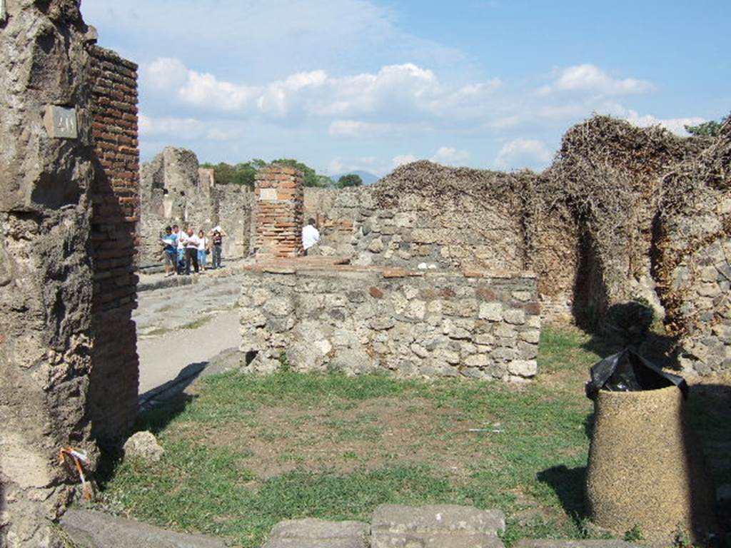 VII.3.40 Pompeii. September 2005. Entrance. According to Della Corte, between the doorways of VII.3.39 and VII.3.40, was written a curious painted graffito. He thought it was written not much after the year 80BC.

Quintio(m)  si  qui  recusant  assidat  ad  asinum      [CIL IV 2887] 

Della Corte translated this as,�Chi rifiuta Quinzio, (o gli e contro nell�elezione), merita la pubblica fustigazione a dorso d�asino�
This roughly translates as �Who refuses Quinzio (or is against in the election), deserves the public flogging on a donkey�s back�.
See Della Corte, M., 1965.  Case ed Abitanti di Pompei. Napoli: Fausto Fiorentino. (p. 125)

According to Fiorelli, at the end of the vicolo near these doorways, there were various painted graffiti. Two of them were

SALINESIBVS . FELICITER

IVDICIS . AVG . FELIC 

The latter was painted in red letters on the upper part of the wall.  Also inscribed in big letters was the word  ROMA.
See Pappalardo, U., 2001. La Descrizione di Pompei per Giuseppe Fiorelli (1875). Napoli: Massa Editore. (p. 88)
