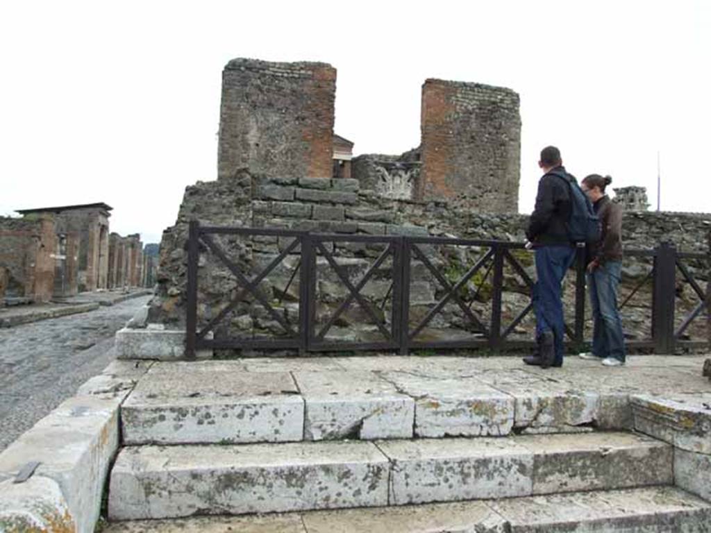 VII.4.1 Pompeii. May 2010. Looking east onto podium. At the top of the steps would have been an iron fence on the left and a gate on the right.