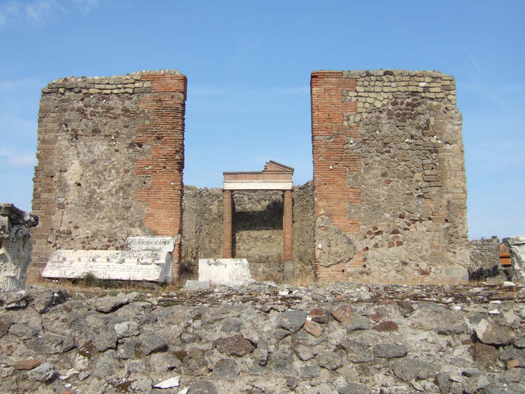 VII.4.1 Pompeii. September 2005. Podium, looking east to cella, or sacred area.
According to Warscher in 1930 -
an inscription on the architrave could be read by any visitor knowing Latin, as it was lying with other marble pieces on the floor of the cella.
See Warscher, T., 1930. Pompeii: in three hours. Rome: Industria Tipografica Imperia, (p.55).
In February 1824, it was reported that various fragments of statues and four inscriptions upon different pieces of marble were also found.
See Fiorelli G., 1862. Pompeianarum antiquitatum historia, Vol. 2: 1819 - 1860, Naples, p. 96.
See Pagano, M. and Prisciandaro, R., 2006. Studio sulle provenienze degli oggetti rinvenuti negli scavi borbonici del regno di Napoli. Naples: Nicola Longobardi. (p.128).