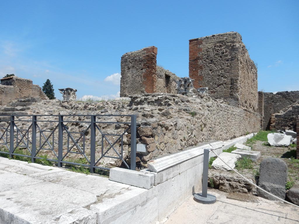 VII.4.1/2, Pompeii. May 2018. Looking east along marble cornice on south side of Temple. Photo courtesy of Buzz Ferebee.
According to Niccolini in 1854, it was believed at first, in the beginning of the excavation, that these various rooms (7, 8, 9, 10 on plan) belonged to the contiguous house called Bacchus, n. 12, but the fact that no communication was found between these rooms and the adjoining house promptly proved this supposition erroneous. On the other hand, it seems to us that now it is to be held firmly that these various localities were instead aggregated to the temple, for the use of the ministers of the temple itself and for their sacred functions, because there is nothing there that suggests that they could be used for domestic purposes.
See Niccolini F, 1854. Le case ed i monumenti di Pompei: Volume Primo. Napoli, Tempio della Fortuna, Tav. I, nn. 7, 8, 9, 10, p. 4.