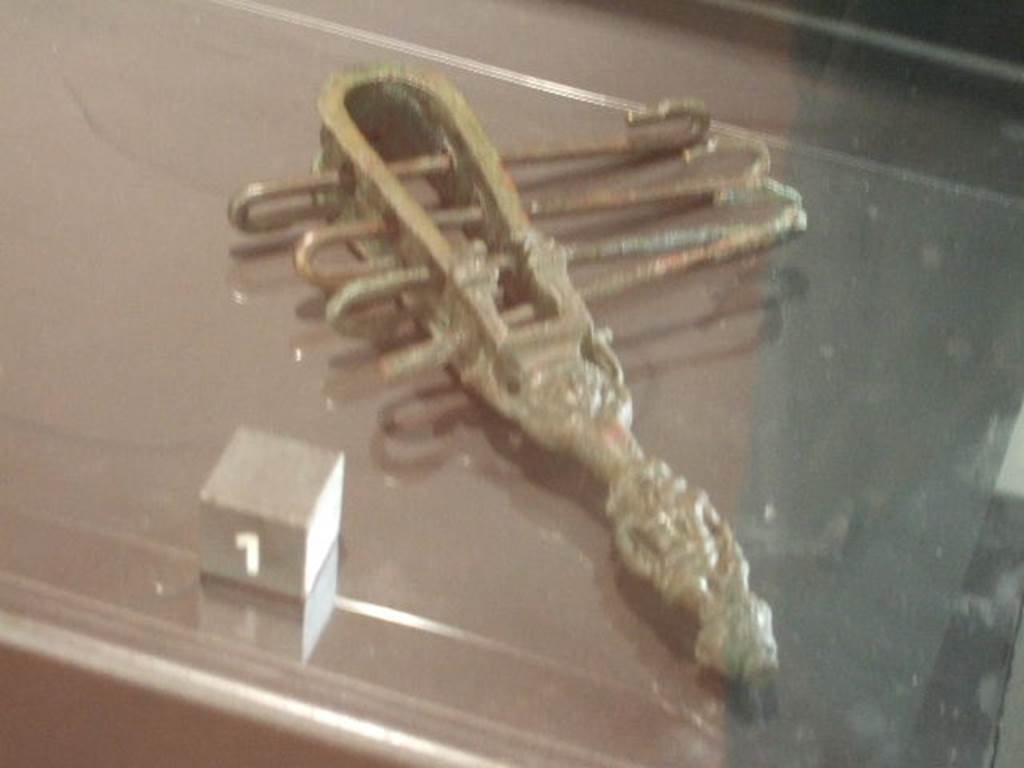 Bronze Sistrum found in VII.4.13. Now in Naples Archaeological Museum.
