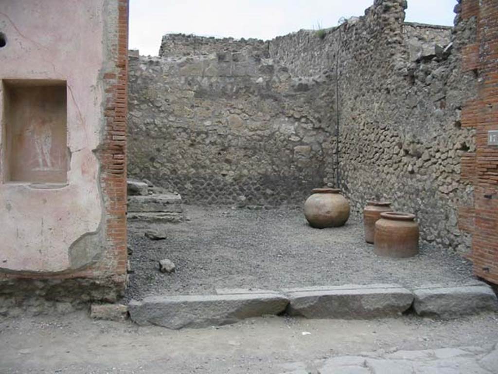 VII.4.17 Pompeii. May 2003. Entrance to shop, with street shrine on west (left) pillar.
Photo courtesy of Nicolas Monteix.