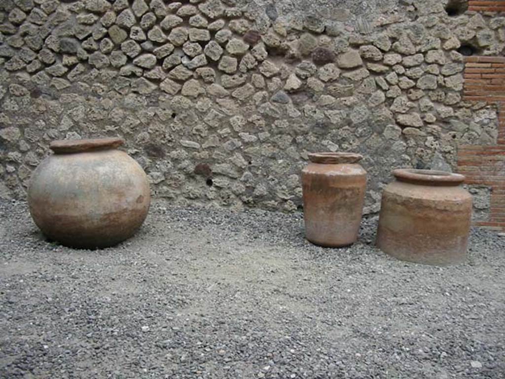 VII.4.17 Pompeii. May 2003. Terracotta pots near east wall. Photo courtesy of Nicolas Monteix.