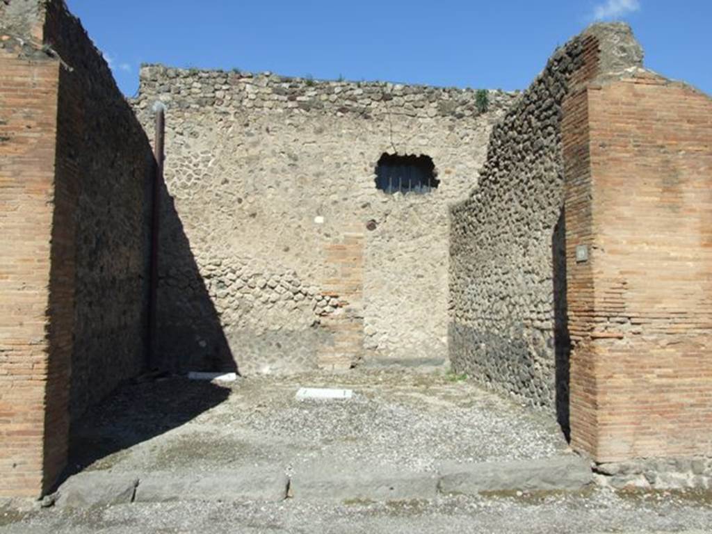 VII.4.19 Pompeii. March 2009. Looking north across shop room towards blocked doorway in north-east corner..