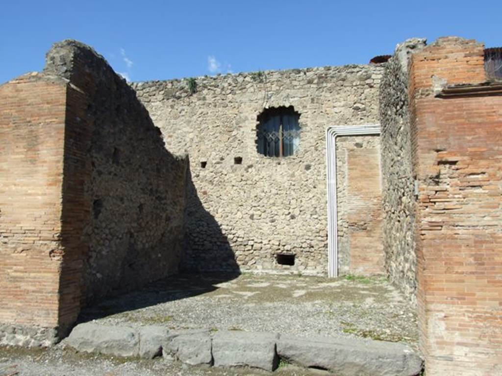 VII.4.20 Pompeii. March 2009. West and North wall of shop room.