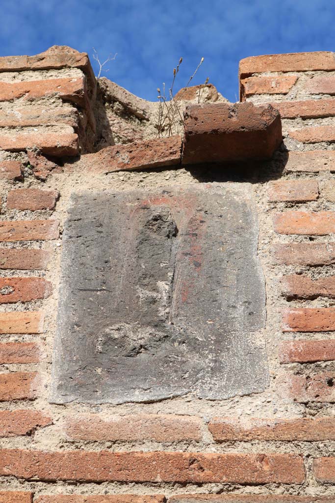 VII.4.27 Pompeii. December 2018.
Plaque on pillar on west (left) side of entrance. Photo courtesy of Aude Durand.