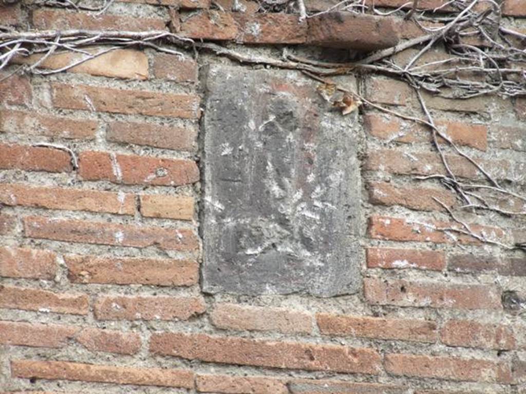 VII.4.27Pompeii. December 2007. Plaque on pillar on west side of entrance.