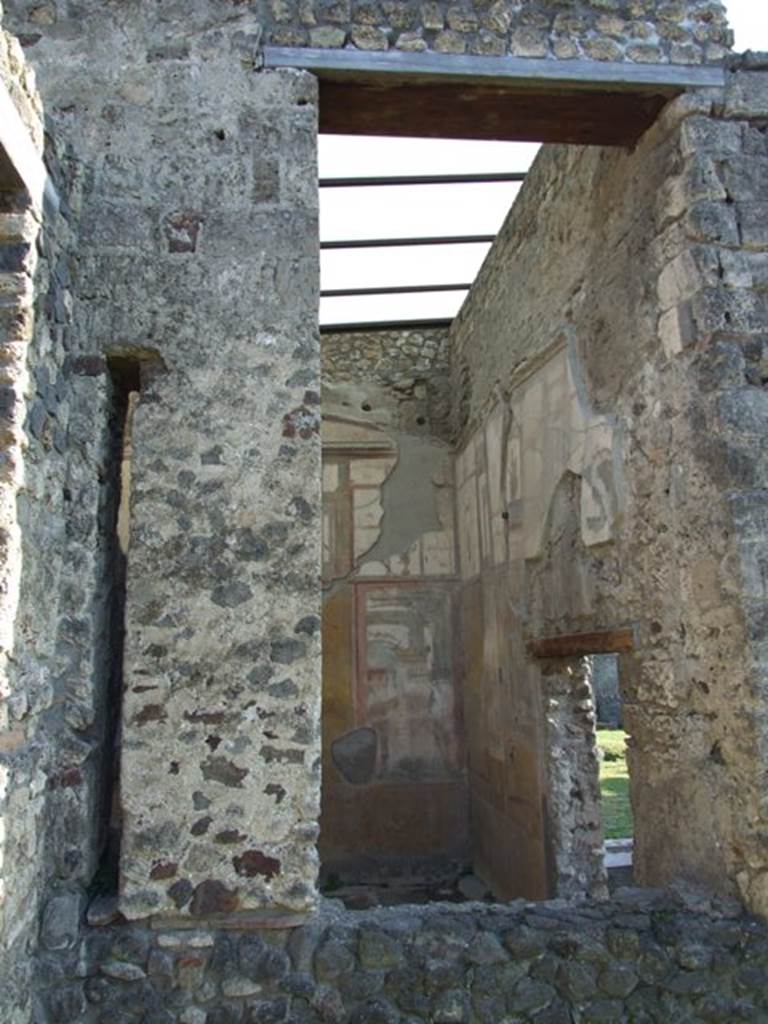 VII.4.31 Pompeii. March 2009. Looking into Room 12, through the window in the south east corner of the Middle Peristyle.