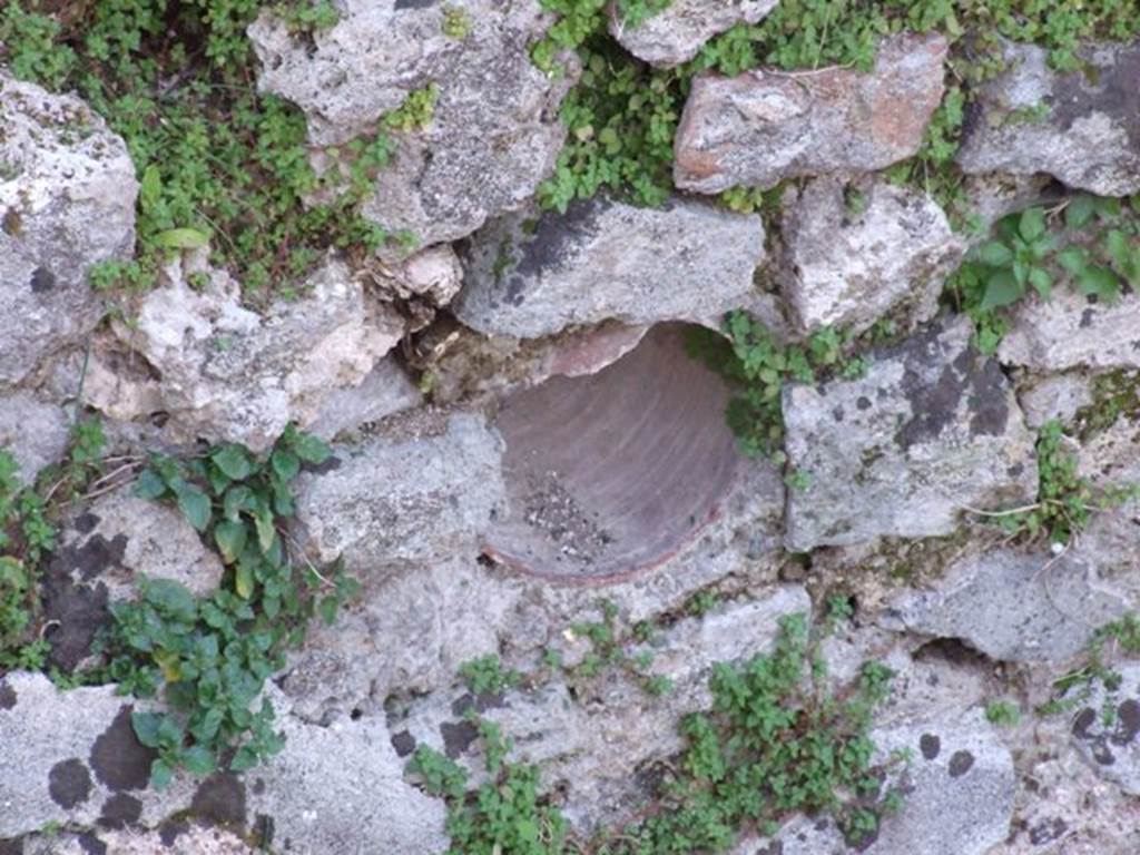 VII.4.31 Pompeii. March 2009. Middle peristyle. West side of fish pool with amphora inserted in pool walls for fishes to shelter and to breed.