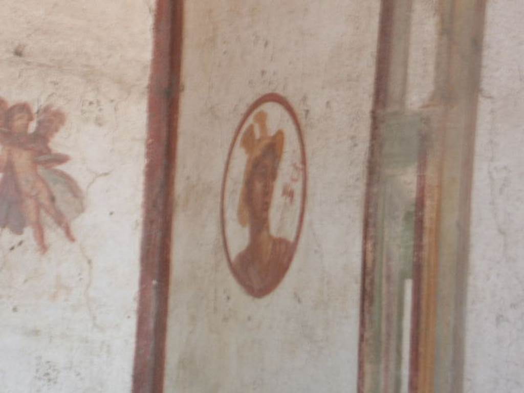 VII.4.48 Pompeii, December 2007. Room 14, cubiculum. North wall, west end. Medallion painting of Hermes or Mercurius.