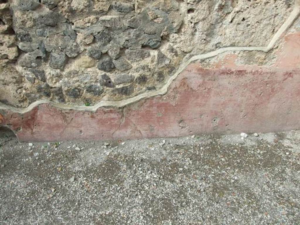 VII.4.48 Pompeii.  March 2009. Room 2.  Atrium. North wall, east side of entrance. Remains of painted plaster.