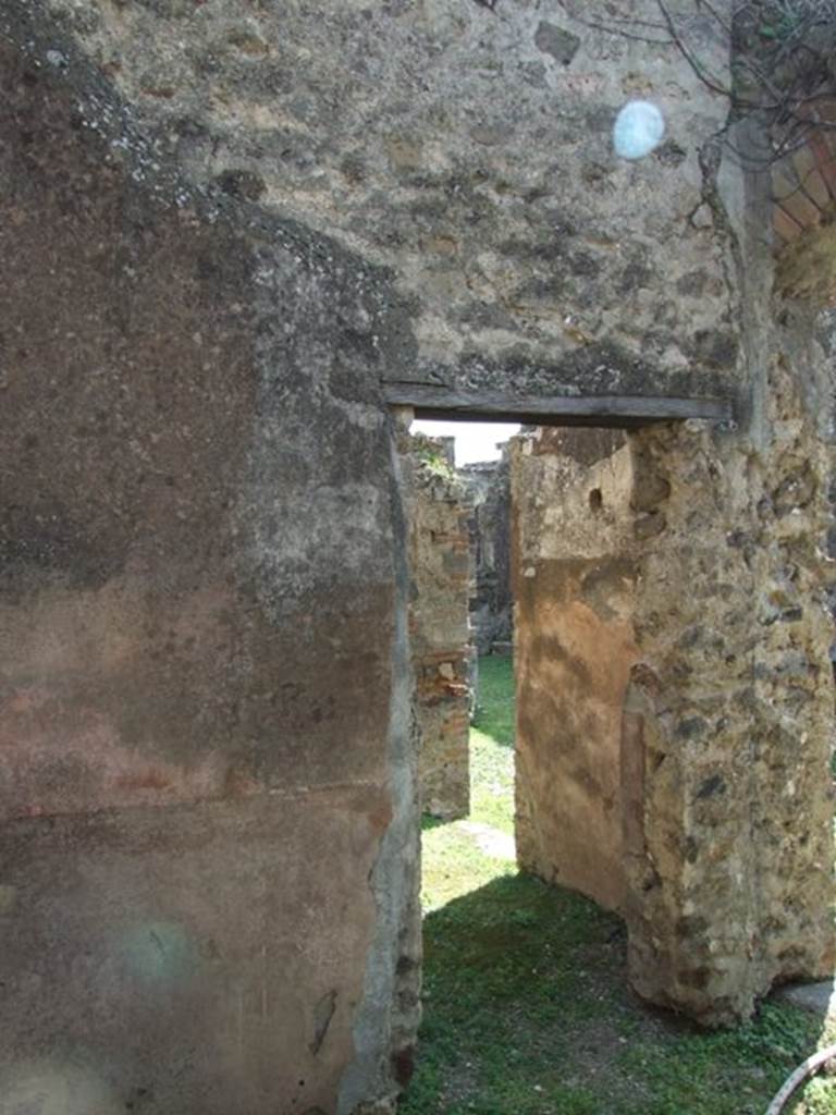 VII.4.56 Pompeii. March 2009. Room 4. Cubiculum. South wall, with small doorway to Room 5.