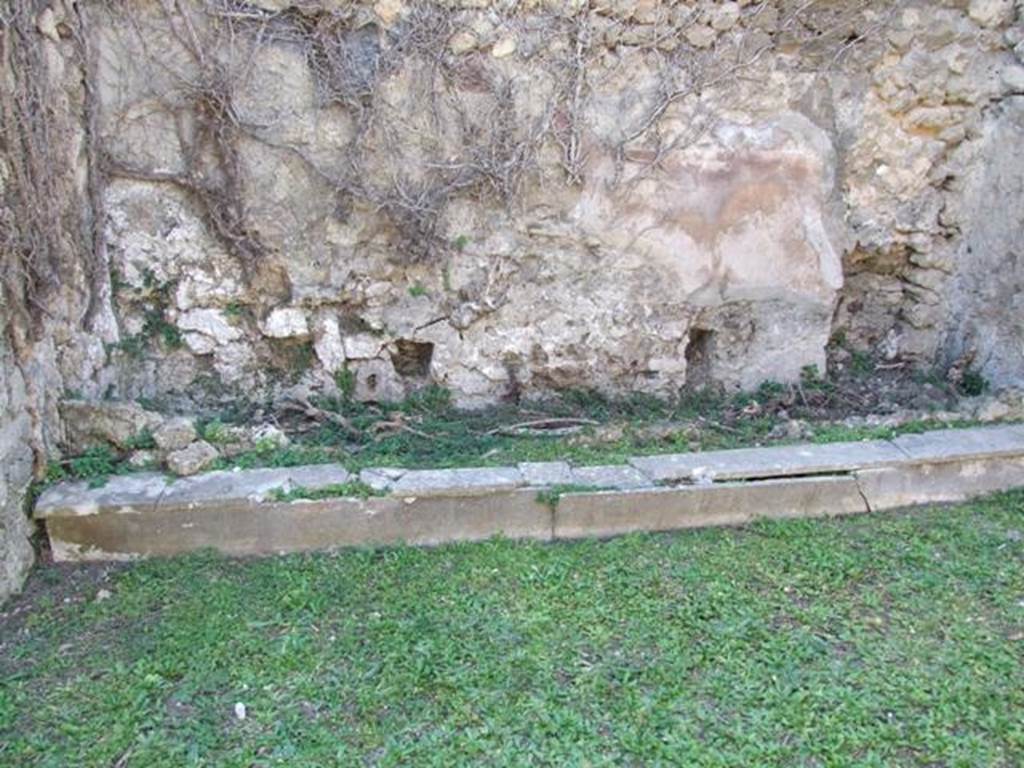VII.4.56 Pompeii. March 2009. Room 9. Tablinum. Cupboard base along base of West wall.