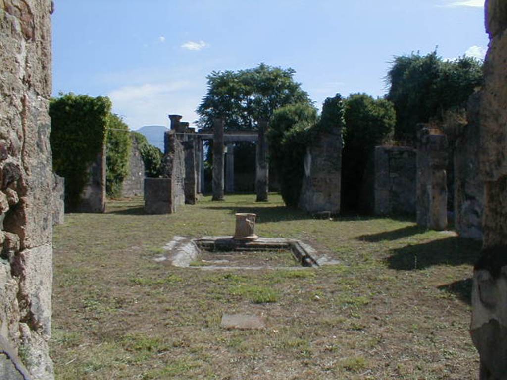 VII.4.57 Pompeii.  September 2004. Atrium and impluvium from entrance fauces.