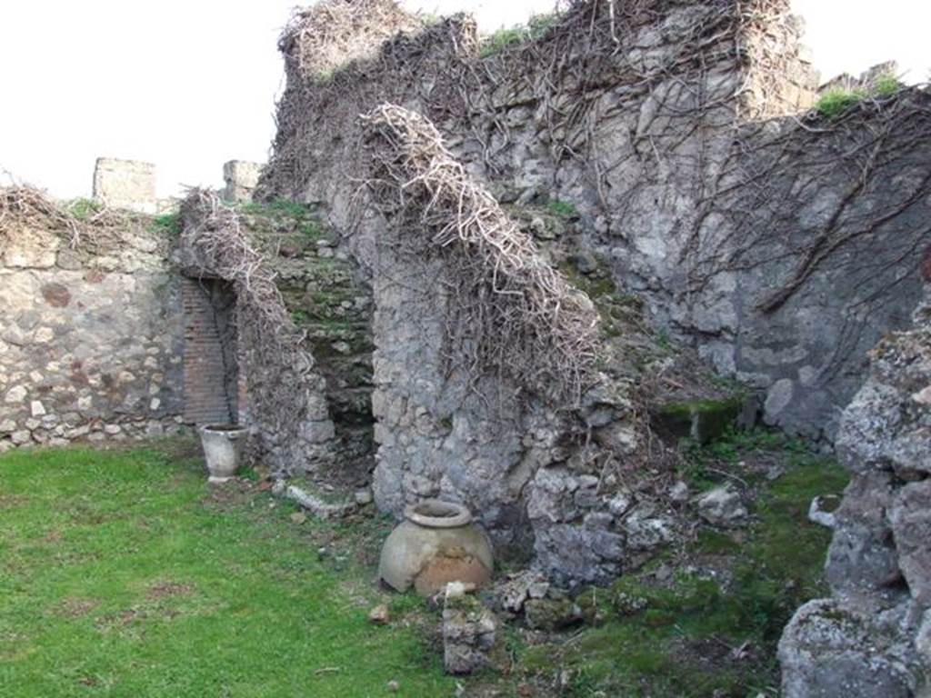VII.4.58 Pompeii. December 2007.
South wall with two rear staircases. On the right, three steps leading to a landing, then seven steps leading to the upper floor.