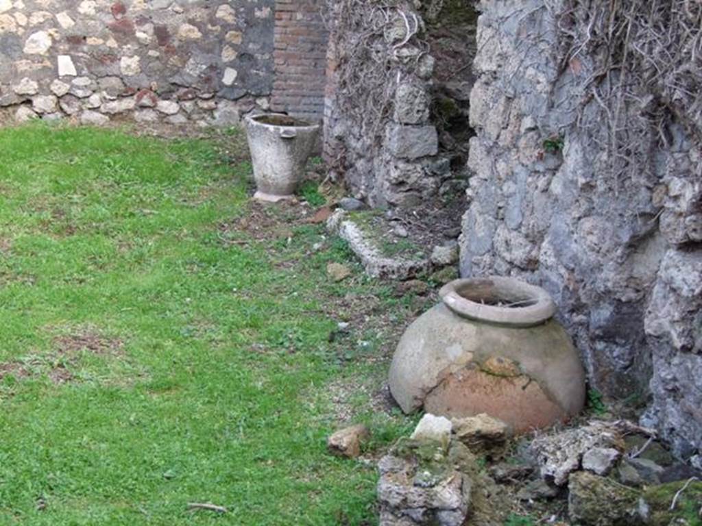 VII.4.58 Pompeii. December 2007. Pot and dolium near two rear staircases.
