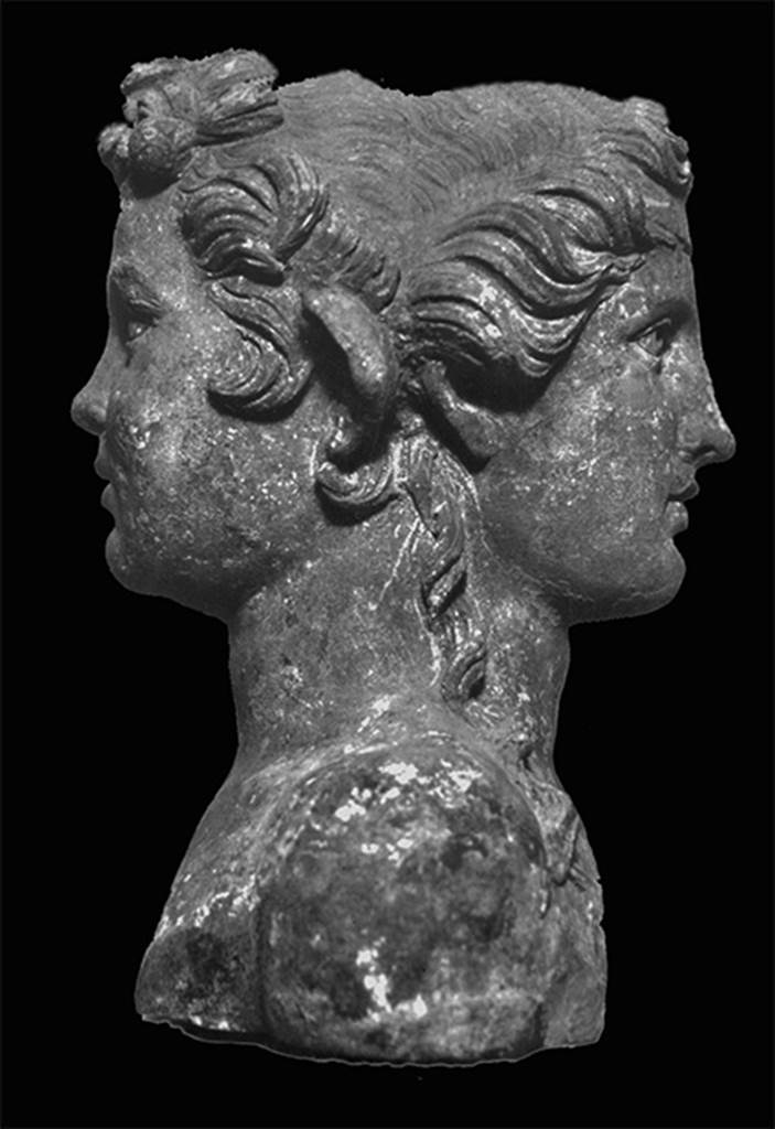 VII.4.60/61 Pompeii. Bronze double herm. One of eight found here.
On one side a young Dionysus with shoulder length curls and hair tie.
On the other side a satyr.
Now in Naples Archaeological Museum. Inventory number 5074.
See Staub-Gierow M., 2000. Casa della Parete Nera: Hauser in Pompeji 10. Munchen: Hirmer, p. 21, taf. 271-274.