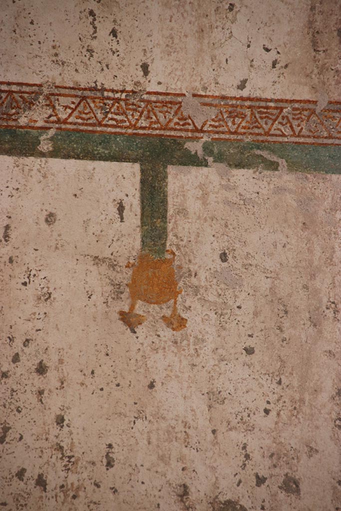 VII.5.8 Pompeii. October 2024.
Tepidarium (49), detail from upper panel on west wall in south-west corner.
Photo courtesy of Klaus Heese.