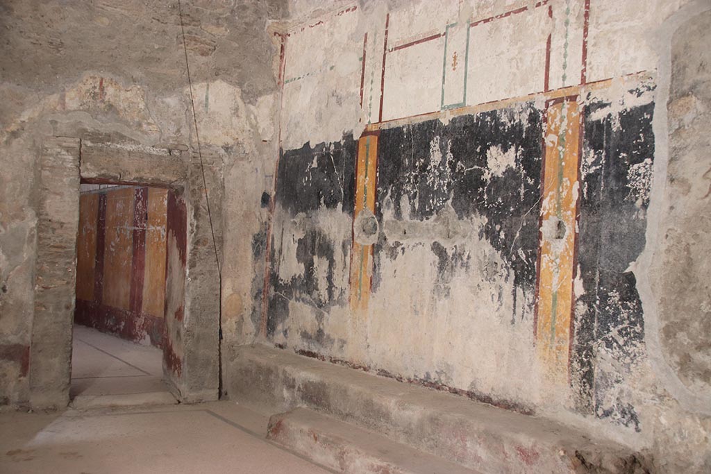 VII.5.8 Pompeii. October 2024.
Changing room (46), south-west corner with doorway into room 49, Tepidarium. Photo courtesy of Klaus Heese.