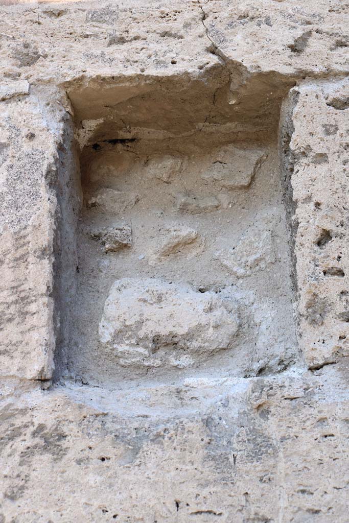 VII.5.15/VII.5.16, Pompeii. December 2018. Detail of niche.
Looking north to square recess/niche in pilaster between blocked doorways.
Photo courtesy of Aude Durand.