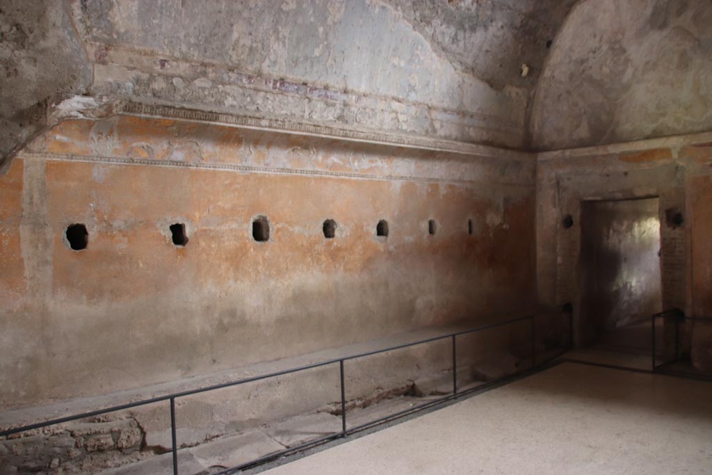 VII.5.24 Pompeii. May 2024.
Looking towards south-east corner along east wall of changing room (14) with benches. Photo courtesy of Klaus Heese.