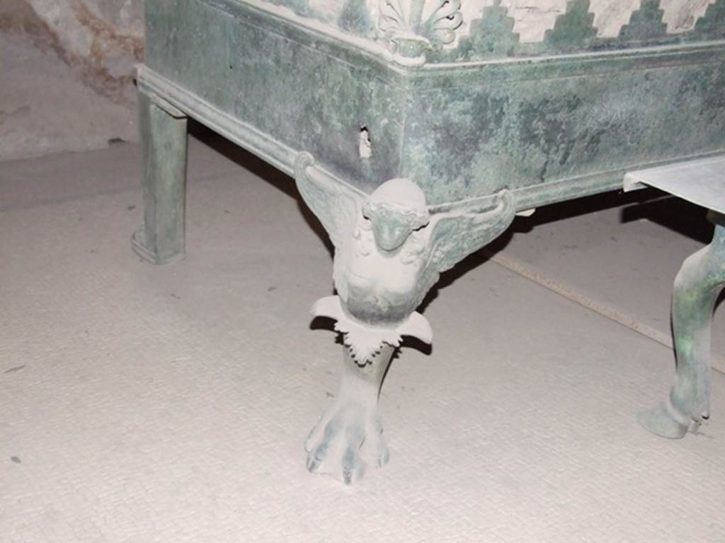 VII.5.24 Pompeii. December 2007. Tepidarium south end. Detail of winged figure decoration and claw foot on brazier (38).