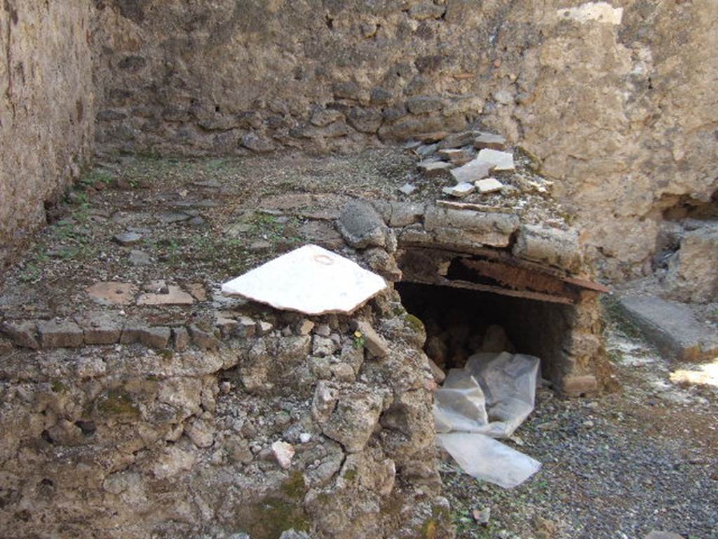 VII.6.30 Pompeii. September 2005. Remains of hearth in kitchen.