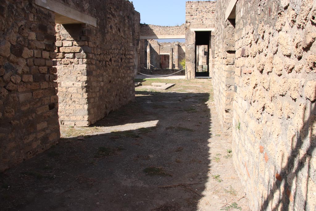 VII.7.2 Pompeii. October 2023.
Looking north along entrance corridor “a”, with doorway to room “b” on left, and room “c” on right. Photo courtesy of Klaus Heese.