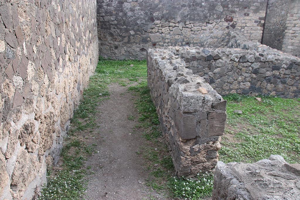 VII.7.2 Pompeii. October 2024. Looking south along east side of area “f” on east side of atrium “g”. Photo courtesy of Klaus Heese.
