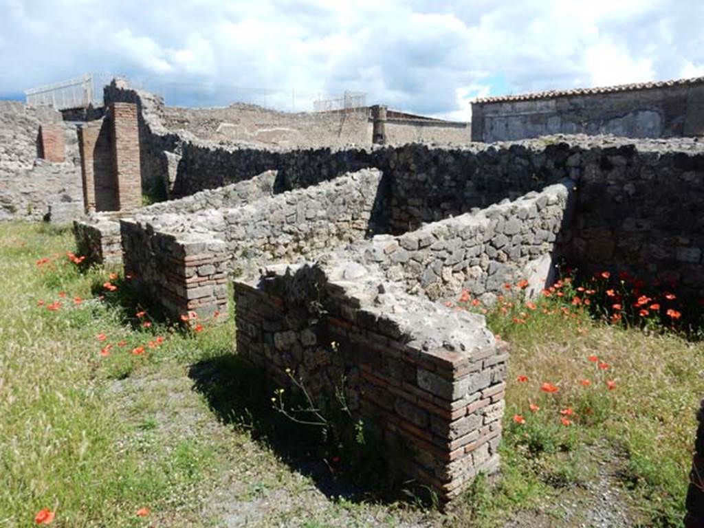VII.7.2 Pompeii, May 2018.
Looking north along three rooms on east side of peristyle, room “q” on right, room “r” in centre, and room “s”. Photo courtesy of Buzz Ferebee.