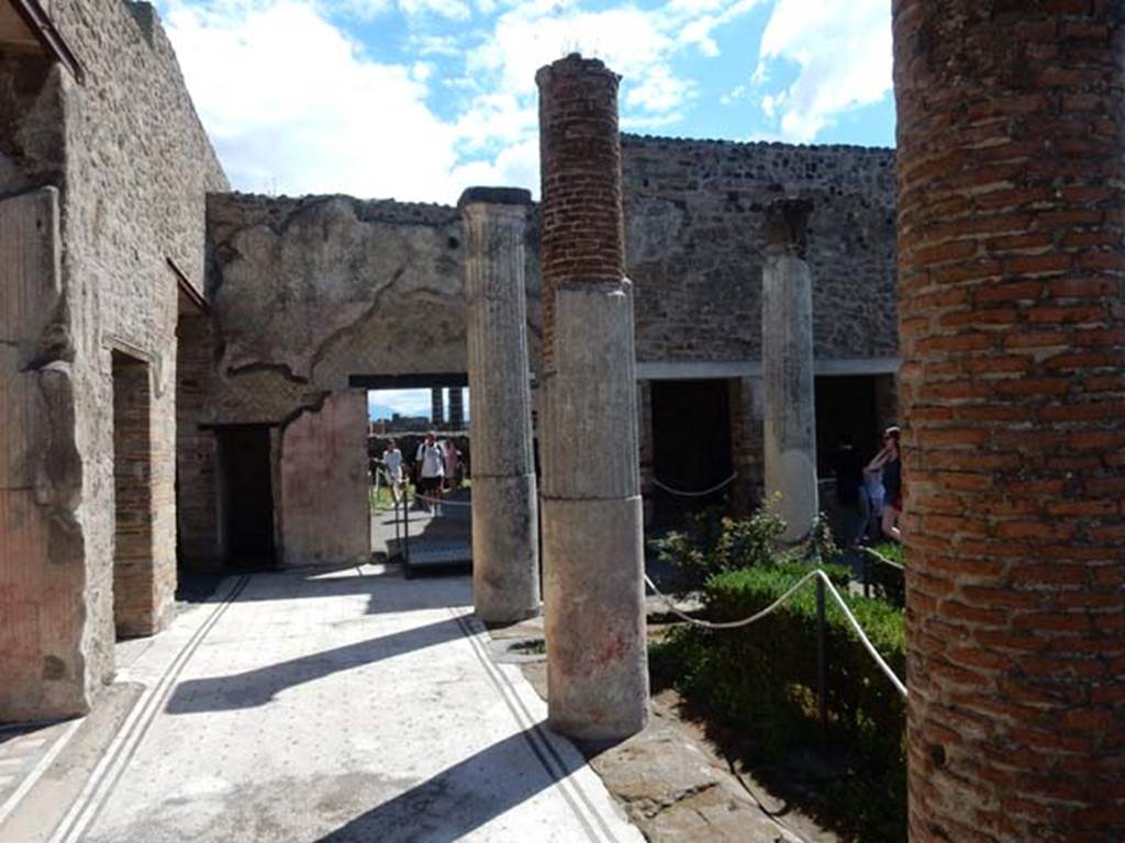 VII.7.5, Pompeii. May 2018. Looking east along north portico.
On the left, north side, after the “open doorway” of the exedra, is the doorway to corridor (r) leading to the rear entrance at VII.7.14, followed by the doorway to room (q).
Ahead, on the east side, is the linking doorway to the south portico of VII.7.2.
Photo courtesy of Buzz Ferebee.