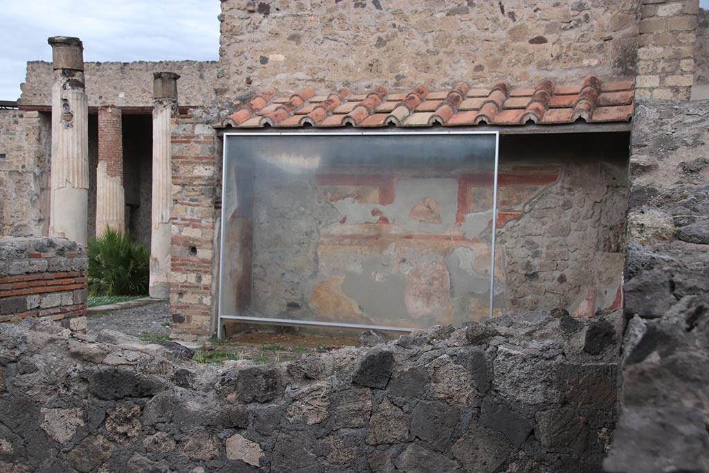 VII.7.5 Pompeii. October 2024.
Room “m”, looking towards north wall, in centre, and north-west across peristyle, on left. Photo courtesy of Klaus Heese.