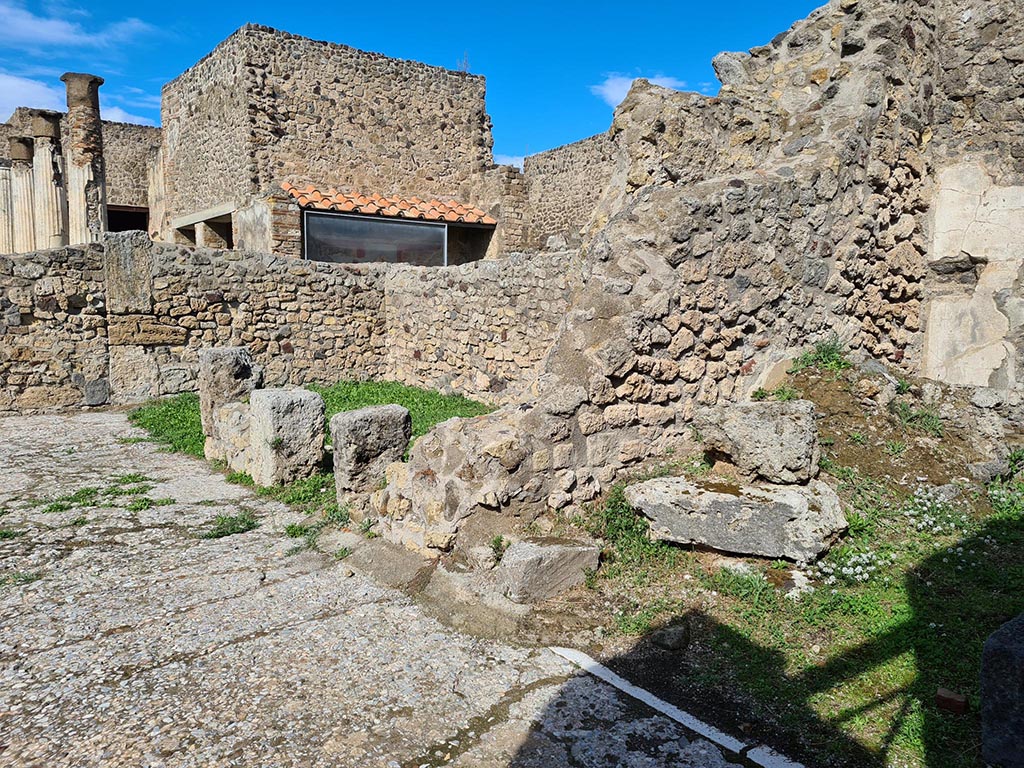 VII.7.5 Pompeii. October 2024. 
Looking towards rooms on east side of atrium, with room (g) in centre, and room (f), on right. Photo courtesy of Klaus Heese.

