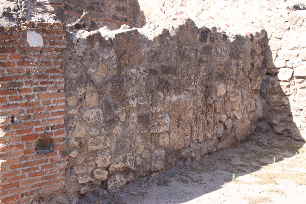 VII.7.7 Pompeii. October 2023. West wall of shop-room. Photo courtesy of Klaus Heese.