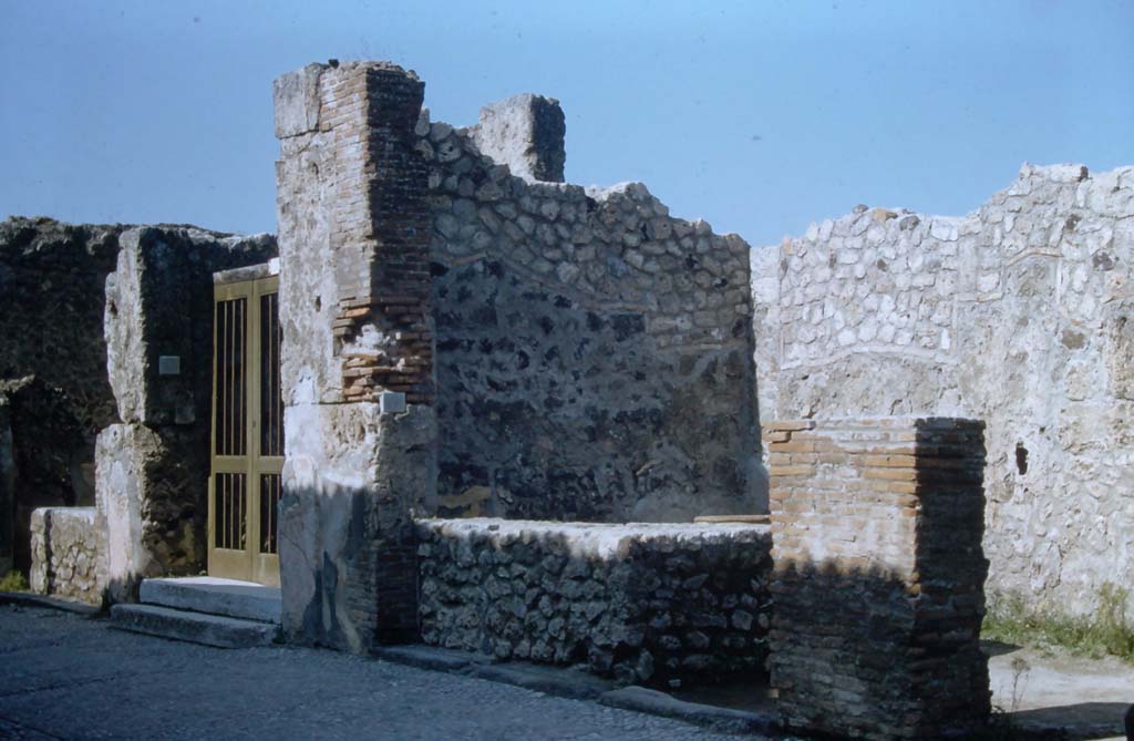 VII.7.11, VII.7.10 and VII.7.9, Pompeii. November 1961.
Entrance doorways on north side of Via Marina. Photo courtesy of Rick Bauer.