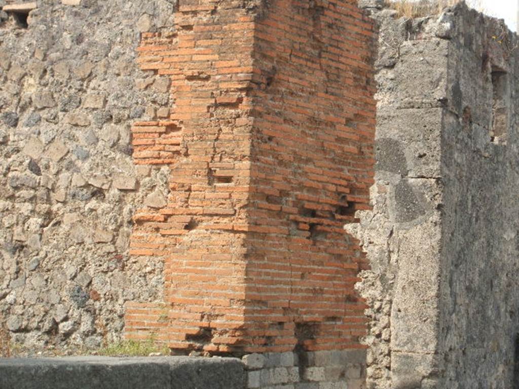 VII.7.24 on left, and entrance doorway to VII.2.23, Pompeii. September 2005.