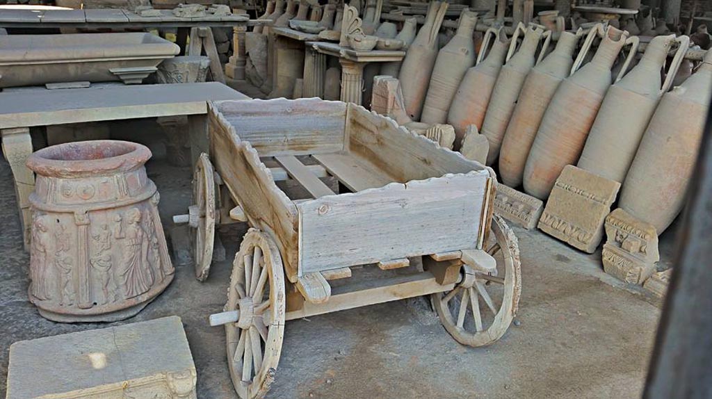 VII.7.29 Pompeii. 2016/2017. Items in storage, and cart, looking north-west. Photo courtesy of Giuseppe Ciaramella.