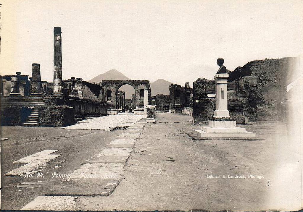 VII.8 Pompeii Forum. 1910. East side of Forum with bust of Giuseppe Fiorelli.
The bust is now in the Larario dei Pompeianisti. Photo courtesy of Ross Turner.
The bronze bust of Fiorelli was erected in the Forum at Pompeii in 1895, a year before his death.
The inscription on the front of the pedestal reads:
IOSEPHO FIORELLI
DE ANTIQVITA TIBUS POMPEIANIS
OPTIME MERITO
EX PVBLICO DECRETO
CIVES VIVENTI CIVI
POSVERVNT
MDCCCXCV
