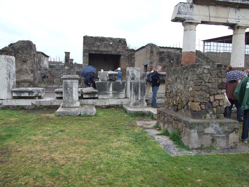 VII.8 Pompeii Forum. May 2010. Statue bases on the west side of the Forum in the north-west corner.