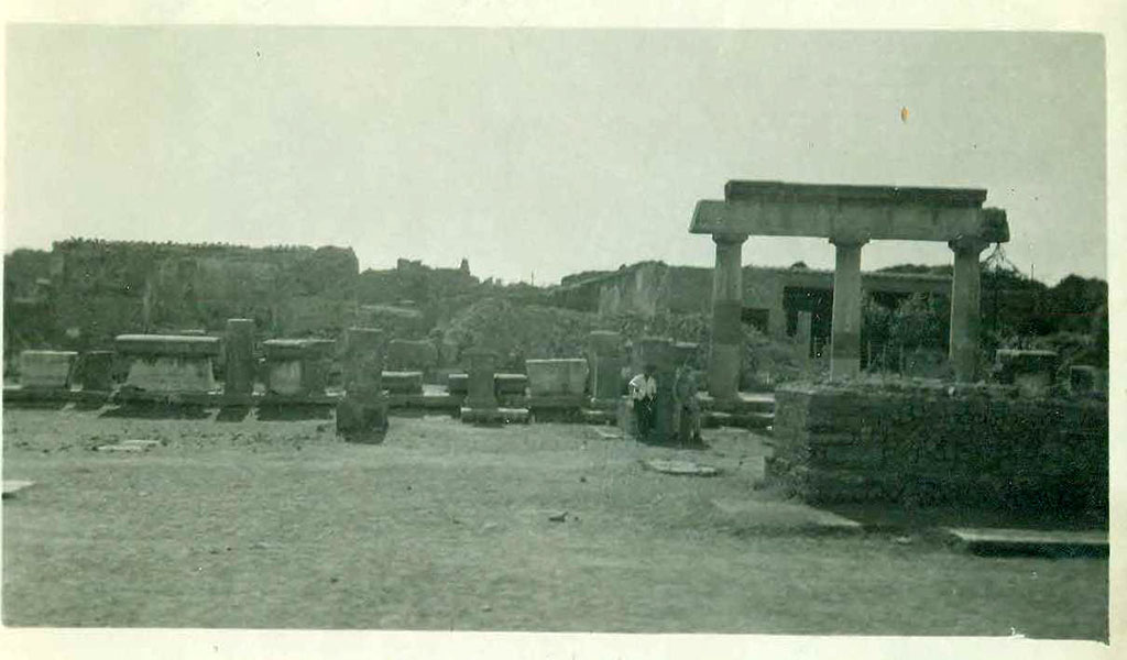VII.8 Pompeii Forum. September 1944. Looking west across forum. Photo courtesy of Rick Bauer.
In the centre rear of the photo there appears to be a pile of rubble, presumably debris from the 1943 bombing.
According to Garcia y Garcia, in this area, which had been reconstructed by Mauri, all the antiquities from pre-Samnite Pompeii were kept.
This area was completely destroyed by bombing in 1943 together with the rooms on its south side, part of the Temple of Apollo, known as “la sagrestia”.
However, the major loss was the destruction of the collection from the archaic period.
The area has now been restored and altered with modern modifications, and once again used as a store for archaeological materials.
See Garcia y Garcia, L., 2006. Danni di guerra a Pompei. Rome: L’Erma di Bretschneider, (p.117).