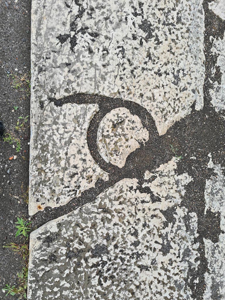VII.8 Pompeii Forum. May 2024.
Letter Q, in a block of the pavement immediately to the east of the very large base which is situated at about the middle of the west side of the Forum. Photo courtesy of Klaus Heese.