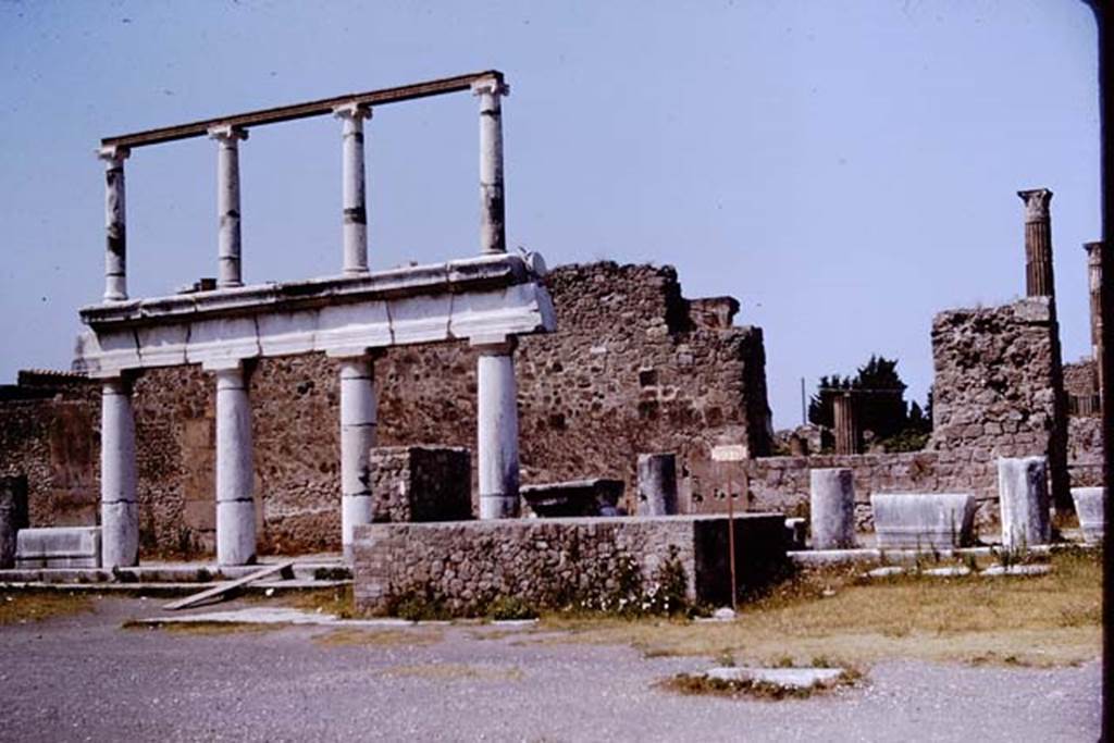 VII.8 Pompeii Forum. 1964. Looking west across Forum towards one of the side entrances to the Temple of Apollo, now partly filled in/closed. Photo by Stanley A. Jashemski.
Source: The Wilhelmina and Stanley A. Jashemski archive in the University of Maryland Library, Special Collections (See collection page) and made available under the Creative Commons Attribution-Non Commercial License v.4. See Licence and use details.
J64f2013