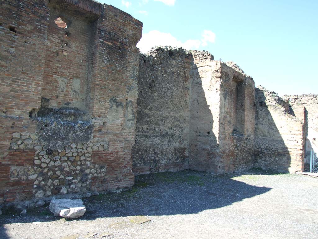 VII.9.1 Pompeii. March 2009. West wall, north of entrance 6. Looking towards small niche 3 in north-west corner of courtyard.