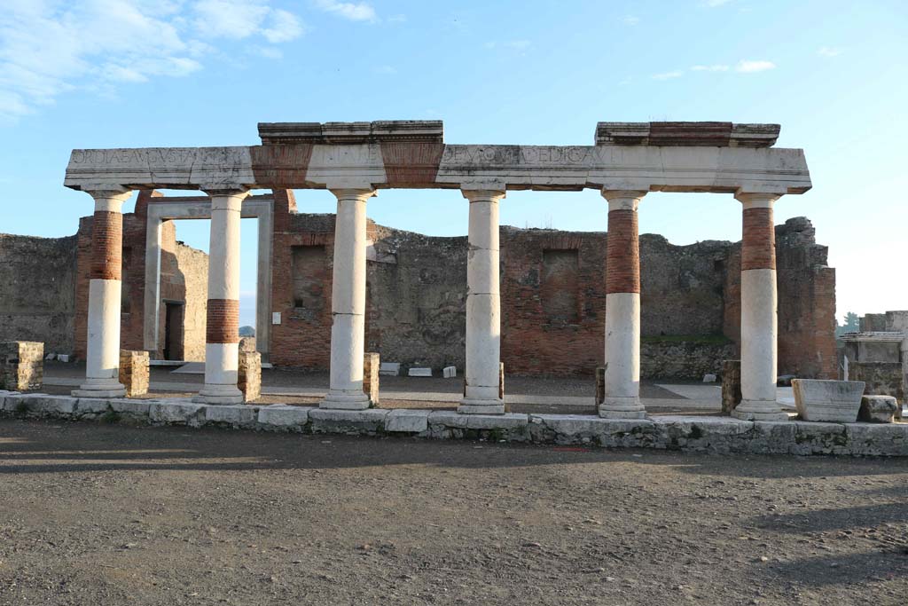 VII.9.1 Pompeii. December 2018.
Looking east across Forum towards Eumachia’s portico, and entrance doorway. Photo courtesy of Aude Durand.