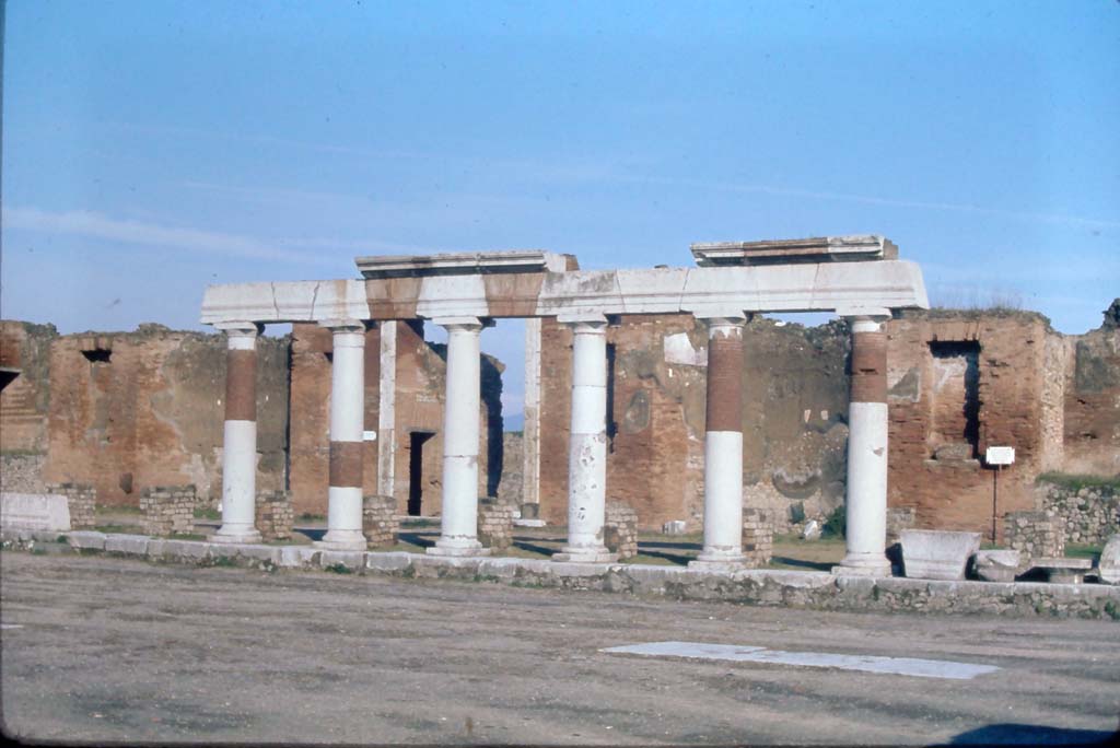 VII.9.1 Pompeii, 4th December 1971. Looking east across Forum towards Eumachia’s portico, and entrance doorway.
Photo courtesy of Rick Bauer, from Dr George Fay’s slides collection.